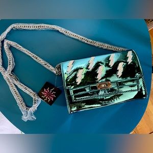 Metallic blue lighting bolt bag